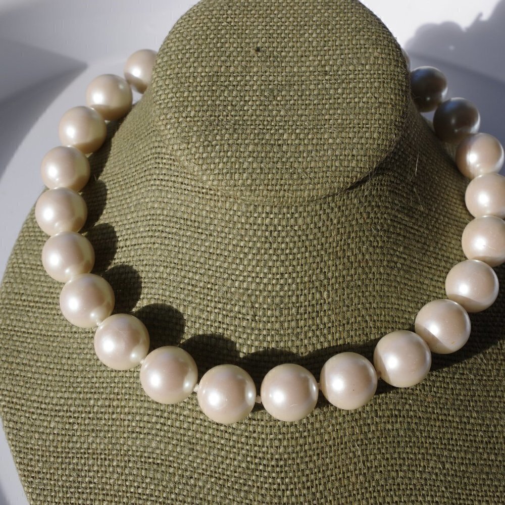 Women`s white faux pearls hand knotted